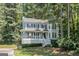 Charming two-story home with a welcoming front porch and lush landscaping at 3 Maplelake Dr, Acworth, GA 30101