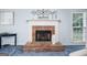 Living room featuring a classic brick fireplace and bright window at 3 Maplelake Dr, Acworth, GA 30101