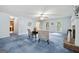 Spacious living room featuring blue carpet, neutral decor, and bright windows at 3 Maplelake Dr, Acworth, GA 30101
