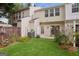 A charming townhouse with a well-manicured lawn, flower beds, wooden fence, and sliding glass doors at 1911 Stancrest Nw Trce, Kennesaw, GA 30152