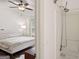 Bathroom featuring a stand up shower, hardwood floors, and a large window at 1911 Stancrest Nw Trce, Kennesaw, GA 30152