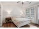 Bright bedroom featuring hardwood floors, recessed lighting, and a large window at 1911 Stancrest Nw Trce, Kennesaw, GA 30152