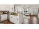 Open kitchen with granite countertops overlooking the bright living area at 1911 Stancrest Nw Trce, Kennesaw, GA 30152