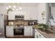 Well-equipped kitchen with stainless steel appliances and granite countertops at 1911 Stancrest Nw Trce, Kennesaw, GA 30152