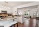 Well-designed kitchen with stainless appliances that opens up to the living room and dining area at 1911 Stancrest Nw Trce, Kennesaw, GA 30152