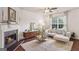 Inviting living room with fireplace, plush sofa, and modern decor, creating a cozy ambiance at 1911 Stancrest Nw Trce, Kennesaw, GA 30152