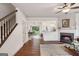 Spacious living room with hardwood floors, leading to the kitchen and dining area at 1911 Stancrest Nw Trce, Kennesaw, GA 30152