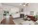 Open-concept living room with fireplace, adjacent to the kitchen and dining area at 1911 Stancrest Nw Trce, Kennesaw, GA 30152