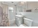 Cozy bathroom featuring updated vanity, tile floors, and shower/tub combo with decorative shower curtain at 222 Bishop Ne Dr, Marietta, GA 30060
