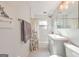 Cozy bathroom featuring updated vanity, tile floors, and shower/tub combo with decorative shower curtain at 222 Bishop Ne Dr, Marietta, GA 30060