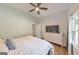 Well-lit bedroom featuring a ceiling fan, dresser, and calming color scheme at 222 Bishop Ne Dr, Marietta, GA 30060