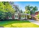 Charming single-story home with brick facade, manicured lawn, and carport at 222 Bishop Ne Dr, Marietta, GA 30060