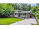 Charming single-story home with brick facade, manicured lawn, and carport at 222 Bishop Ne Dr, Marietta, GA 30060