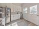 Bright kitchen with stainless steel appliances, white cabinetry, and modern backsplash at 222 Bishop Ne Dr, Marietta, GA 30060