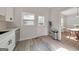 Bright kitchen with white cabinets, stainless steel appliances, and adjoining dining space at 222 Bishop Ne Dr, Marietta, GA 30060