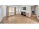 Spacious living room featuring hardwood floors, natural light, and TV at 222 Bishop Ne Dr, Marietta, GA 30060
