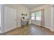 Bright office space with a modern desk, natural light, and hardwood flooring at 222 Bishop Ne Dr, Marietta, GA 30060