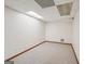 Unfinished carpeted basement area with white walls and wood trim at 2110 Waterloo Cir, Lawrenceville, GA 30043