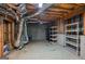 Unfinished basement storage space featuring shelving units at 2110 Waterloo Cir, Lawrenceville, GA 30043