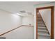 Carpeted basement area with stairway to the right of the room at 2110 Waterloo Cir, Lawrenceville, GA 30043