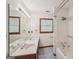 Bathroom featuring a double vanity sink, tub, and a window at 2110 Waterloo Cir, Lawrenceville, GA 30043