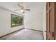 Bright bedroom with a window that provides ample natural light, ceiling fan, and neutral carpet at 2110 Waterloo Cir, Lawrenceville, GA 30043