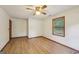 Spacious bedroom featuring hardwood floors, a window, and a closet for storage at 2110 Waterloo Cir, Lawrenceville, GA 30043