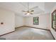 Large bedroom with a ceiling fan and views of the outdoors at 2110 Waterloo Cir, Lawrenceville, GA 30043