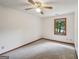 This bedroom is carpeted and has a ceiling fan and window for natural light at 2110 Waterloo Cir, Lawrenceville, GA 30043