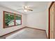 This bedroom is carpeted and features a window for plenty of natural light at 2110 Waterloo Cir, Lawrenceville, GA 30043