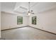 Bright, spacious bedroom featuring a tray ceiling and neutral carpet at 2110 Waterloo Cir, Lawrenceville, GA 30043