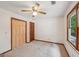 This carpeted bedroom has a window for natural light and a closet for storage at 2110 Waterloo Cir, Lawrenceville, GA 30043