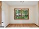Sunlit bedroom with hardwood floors and a large window overlooking the landscaped yard at 2110 Waterloo Cir, Lawrenceville, GA 30043
