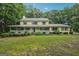 Charming two-story home with inviting front porch and beautifully landscaped front yard at 2110 Waterloo Cir, Lawrenceville, GA 30043
