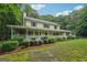 Charming two-story home with inviting front porch and beautifully landscaped front yard at 2110 Waterloo Cir, Lawrenceville, GA 30043
