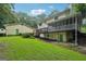 Exterior view of home with expansive backyard, deck, and screened porch at 2110 Waterloo Cir, Lawrenceville, GA 30043
