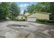 Well-maintained home with a garage, showcasing its inviting curb appeal and ample parking space at 2110 Waterloo Cir, Lawrenceville, GA 30043