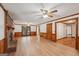 Spacious living room with brick fireplace, wood-look floors, and natural light at 2110 Waterloo Cir, Lawrenceville, GA 30043