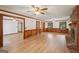 Open living room featuring wood paneling, wood-look floors, and access to multiple rooms at 2110 Waterloo Cir, Lawrenceville, GA 30043