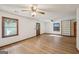 Bright living room with wood floors, big windows, and custom built-in shelves at 2110 Waterloo Cir, Lawrenceville, GA 30043