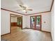 Open living area with hardwood floors, wood trim, and a glass door leading to the deck at 2110 Waterloo Cir, Lawrenceville, GA 30043