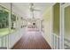 Long screened-in porch with ceiling fans and backyard view at 2110 Waterloo Cir, Lawrenceville, GA 30043