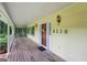 Inviting covered porch with wood flooring and the house number on the wall at 2110 Waterloo Cir, Lawrenceville, GA 30043