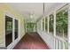 Screened-in porch with ceiling fans and wood flooring at 2110 Waterloo Cir, Lawrenceville, GA 30043
