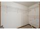 This walk-in closet features white walls and shelving for ample storage space at 2110 Waterloo Cir, Lawrenceville, GA 30043