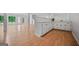 Large basement area features wood-look floors and built-in bar with ample counter space and storage at 3332 St John Dr, East Point, GA 30344