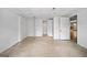 Unfinished basement with white walls, concrete flooring, and door leading outside for easy access at 3332 St John Dr, East Point, GA 30344