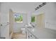 Bright bathroom featuring neutral tile, vanity, and tub/shower combo at 3332 St John Dr, East Point, GA 30344