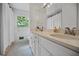 Bathroom with double sinks, framed mirror, and shower/tub combination at 3332 St John Dr, East Point, GA 30344