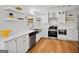 Updated kitchen with stainless steel appliances, modern countertops, and white cabinetry at 3332 St John Dr, East Point, GA 30344